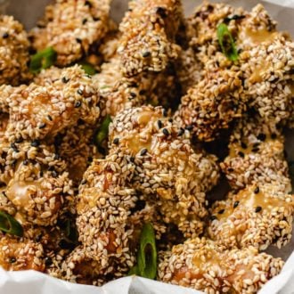 A plate loaded with crispy sesame chicken
