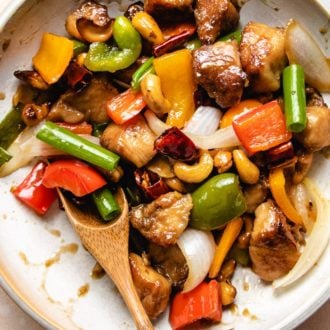 Cashew nuts and chicken stir-fry Thai style in a white plate