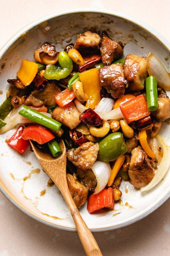 Cashew nuts and chicken stir-fry Thai style in a white plate