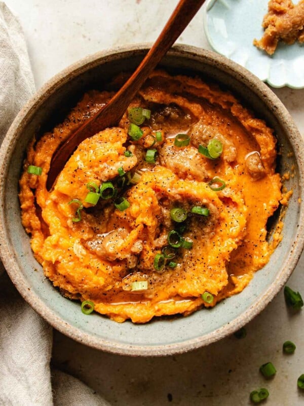 Feature image shows a bowl of miso sweet potatoes blended with butter and served in a bowl.