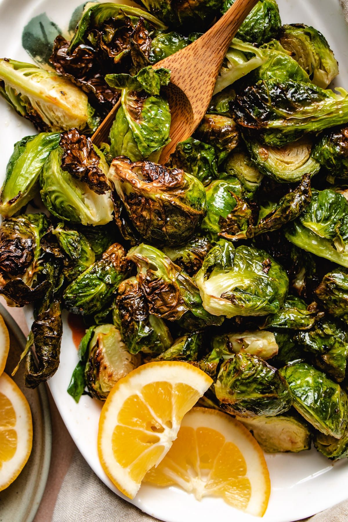 A feature image shows maple glazed brussel sprouts air fry to crisp and drizzle with maple lemon sauce. 