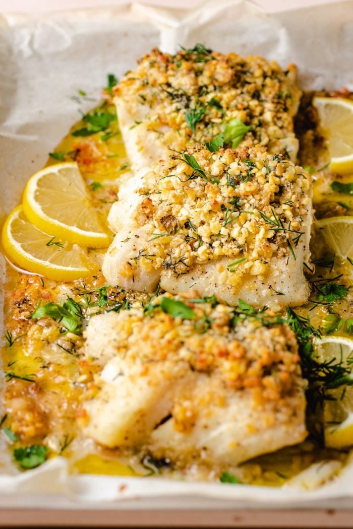 A side shot shows 3 cod fillets after out of the oven with golden panko crust on top
