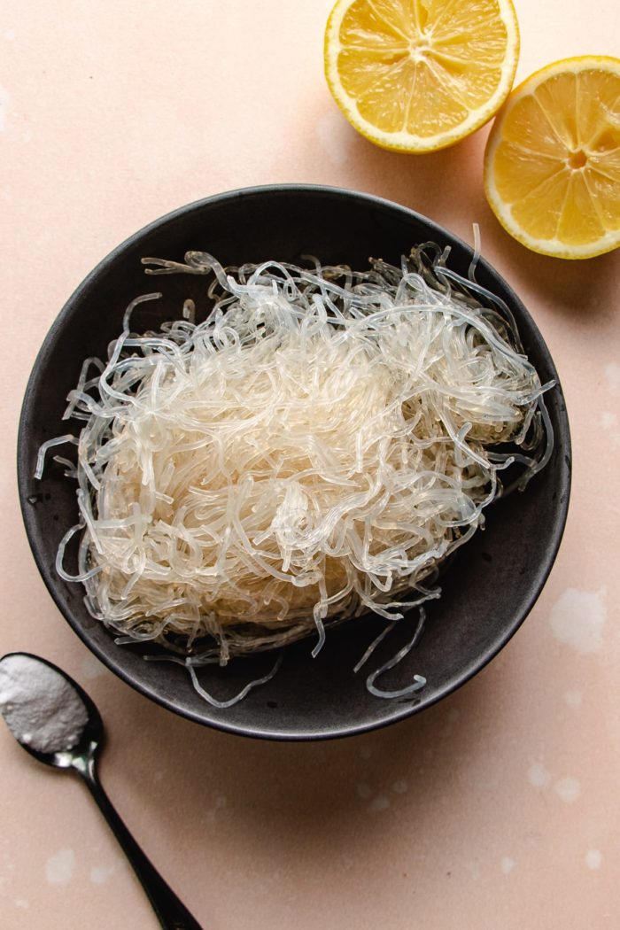 Photo shows Kelp noodles taken out of the package with lemon and baking soda on the side.