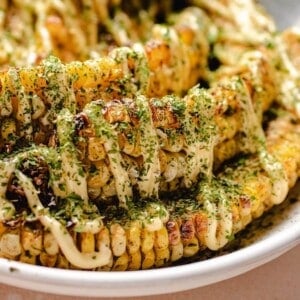 Photo shows corn ribs made in air fryer served on a plate