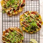 Photo shows 3 rice paper made Vietnamese Pizza on a cooling wire rack