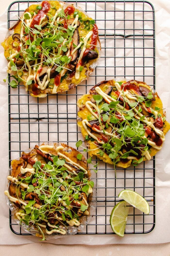 Photo shows 3 rice paper made vietnamese style pizza over a cooling wire rack