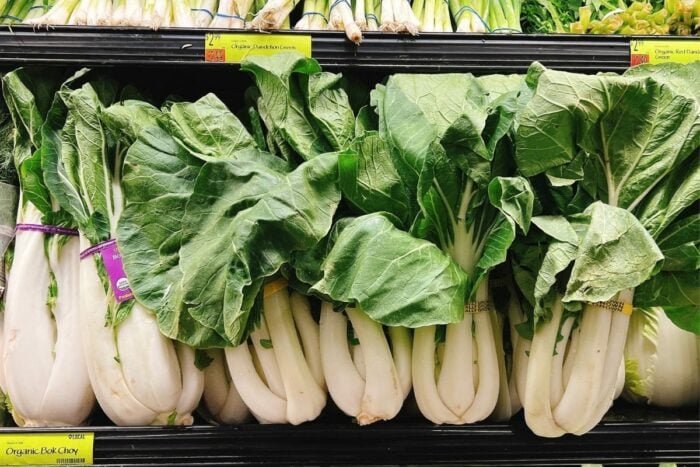 Regular bok choy size with white stalks and green leafy greens