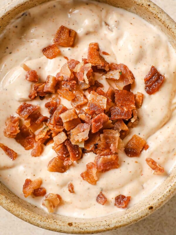 Bacon aioli sauce with creamy texture and crispy bacon bits served in a ceramic bowl