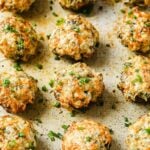 Recipe with keto stuffed mushrooms baked on a sheet pan