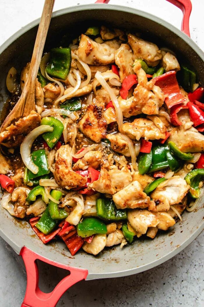 A close shot of the cooked shacha chicken in a saute pan