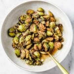 A feature image shows Asian roasted brussels sprouts served over a big white plate