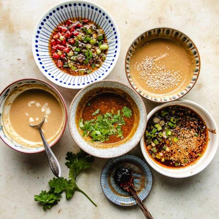 A close shot shows 5 hotpot sauce recipe in 5 individual bowls