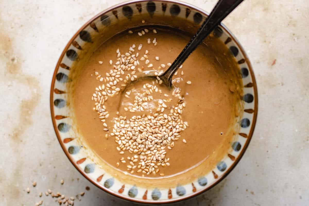 A close shot shows Japanese shabu dipping sauce mixed in a bowl