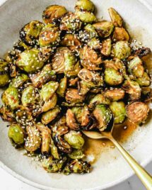 Asian brussels sprouts recipe served in a light color white gray bowl