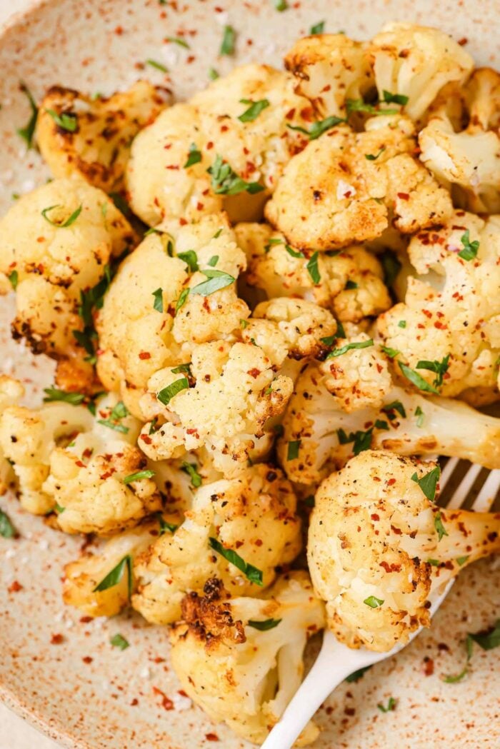 A side close shot shows crispy texture of cauliflower florets after air frying