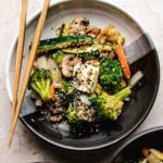 Recipe for hibachi vegetables stir fried and served in a black/white color plate