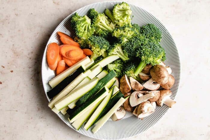 Photo shows vegetables cut up in hibachi style and presented in a large plate