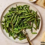 Recipe image for Air fry frozen green beans cooked to perfectly crisp and tender served on a plate