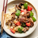 A recipe image shows black pepper stir fry beef served on a white plate with rice.