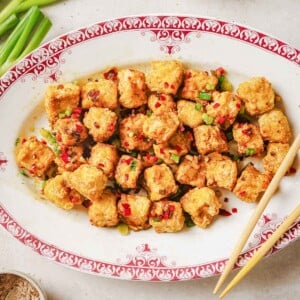 Recipe photo shows air fried crispy salt pepper tofu served on a white plate