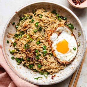 A recipe image shows rice ramen noodles with chili oil served in a plate with a fried egg.