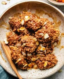 Photo shows copycat Panda Express almond chicken dish with crispy chicken breast and almond coated in a sweet savory sauce,