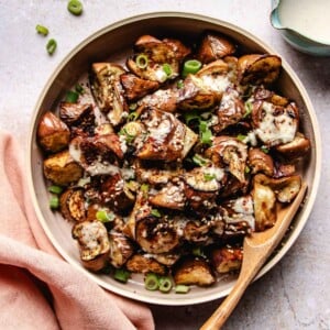 A recipe image shows roasted Asian eggplant tossed with a creamy sauce served in a plate