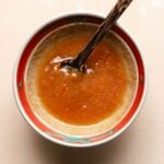 Egg roll dipping sauce recipe image served in a bowl with a little spoon on the side.