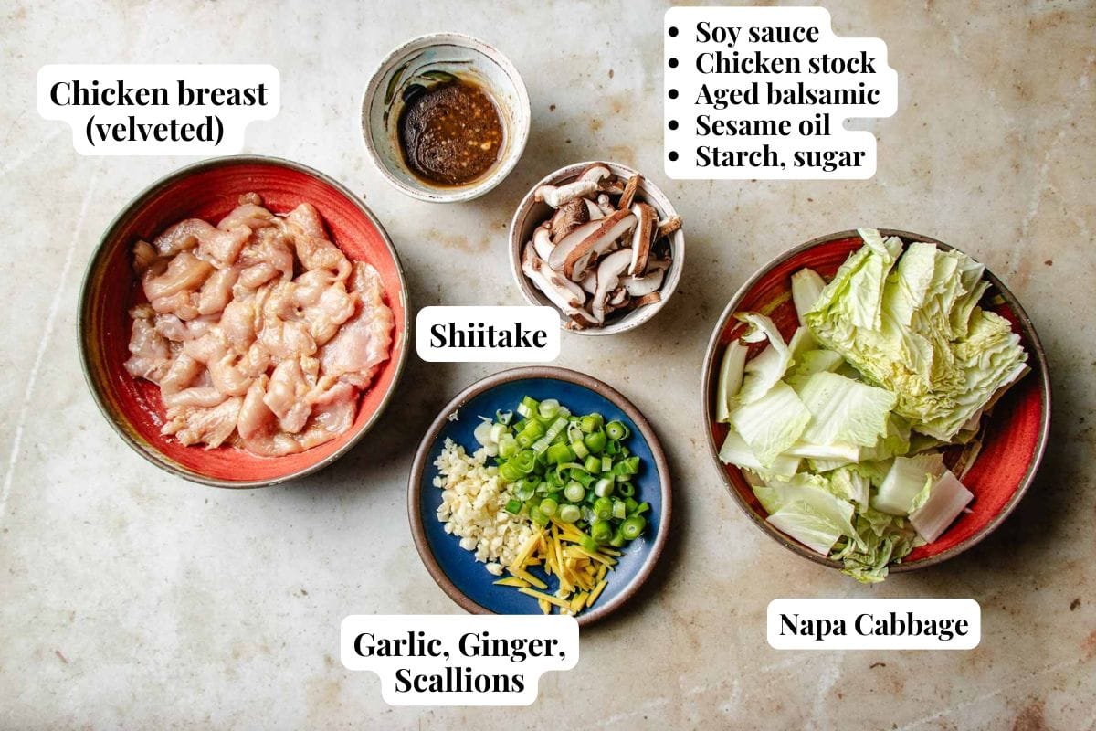Bowls featuring Chinese Chicken and cabbage stir fry with sliced chicken breast, shiitake mushrooms, garlic, ginger, scallions, napa cabbage, and a savory sauce of soy sauce, chicken stock, aged balsamic, sesame oil, starch, and sugar.