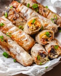 Rice paper egg rolls with vegetables inside and fried to crispy.