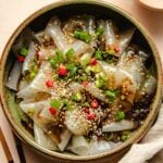 Recipe image for rice paper noodles served in a plate with garnishes and sauce on top