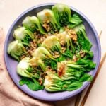 A recipe image shows steamed bok choy on a purple colored plate with oyster garlic sauce on top.