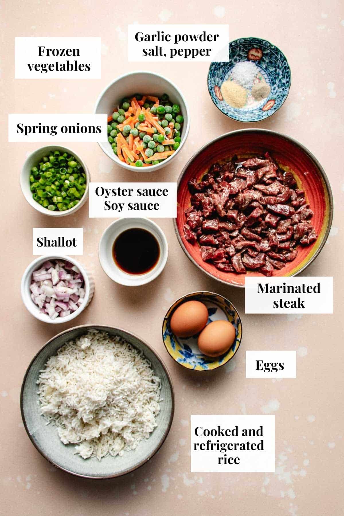 Photo shows ingredients used to make fried rice with steak.