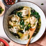 Recipe image shows wontons in egg drop soup with spinach and seaweed to flavorful the broth.