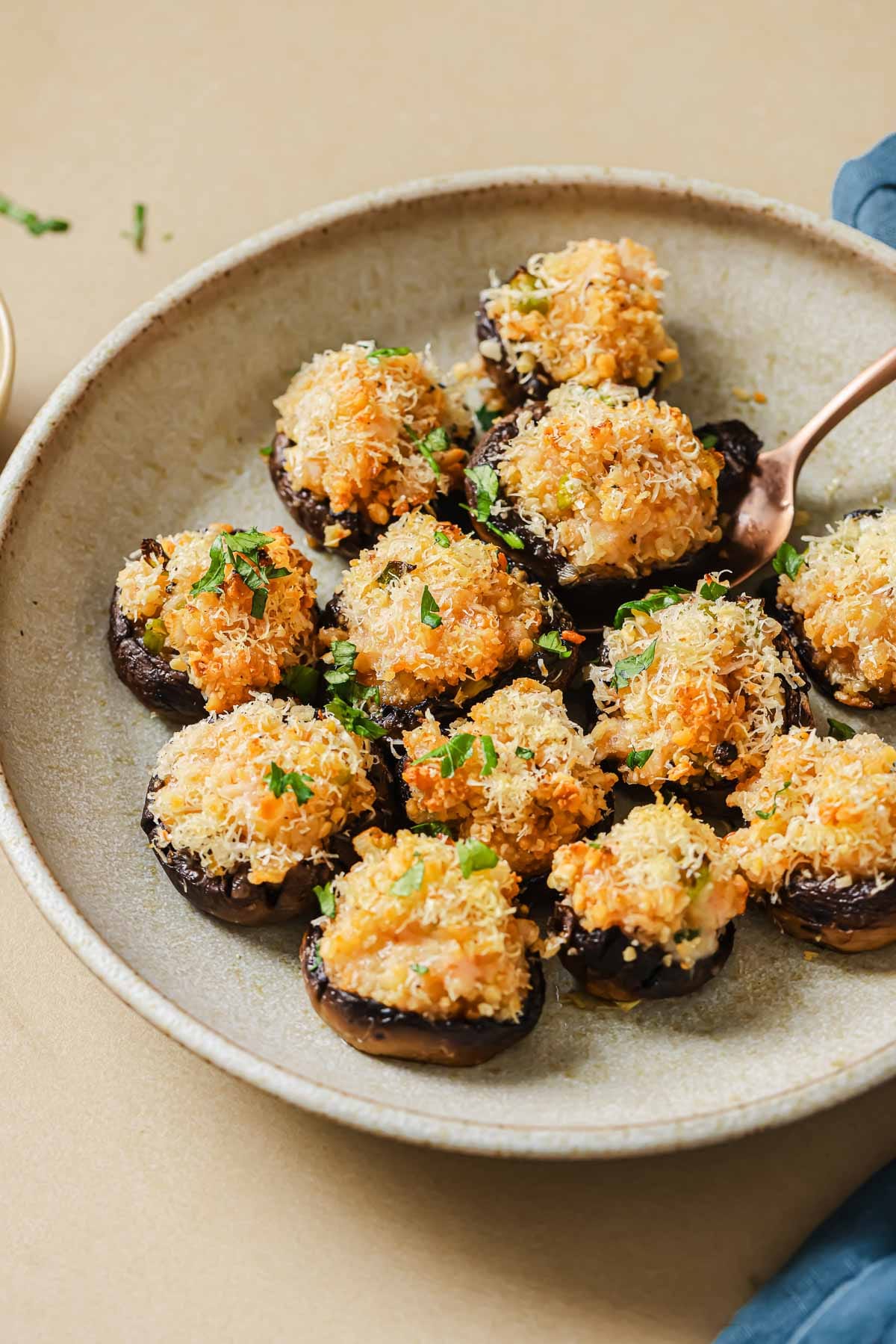 A feature side shot image shows baked and stuffed mushrooms with shrimp and seafood filling with panko crust on top.