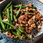 Recipe image for ground chicken stir fry and green beans, served with rice in a bowl.