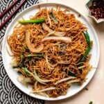 Recipe image shows Cantonese style crispy chow mein noodles served in a white plate.