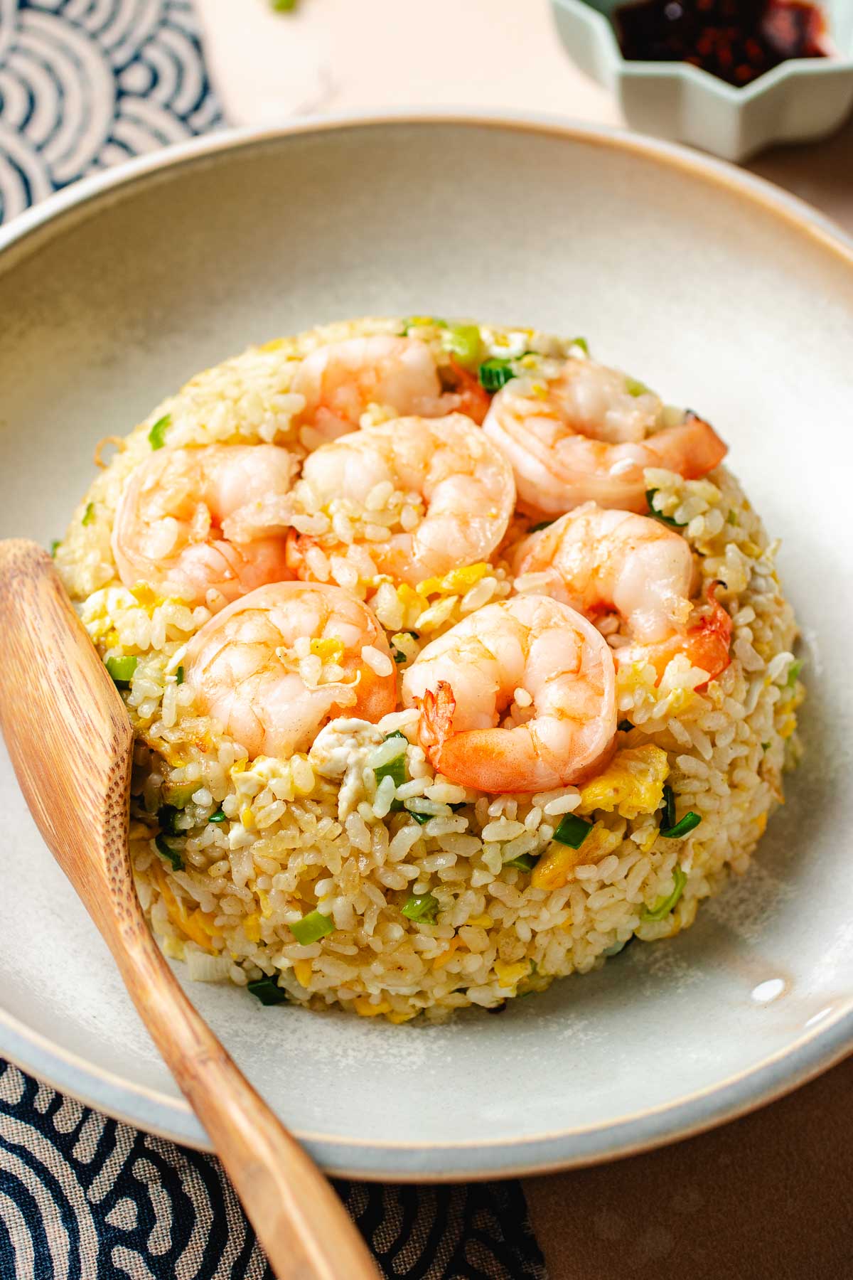 Image shows Din Tai Fung fried rice recipe with shrimp and eggs plated and served just like the restaurant's in a plate.