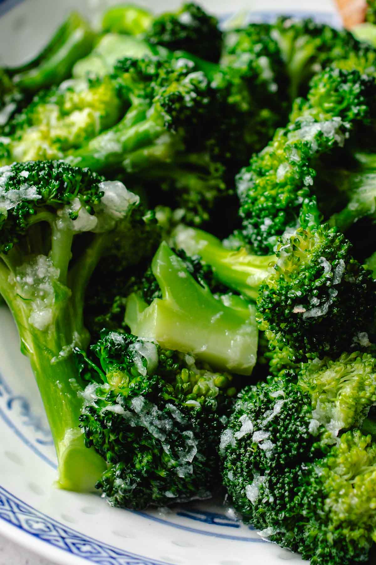 A side close shot shows perfectly cooked broccoli in garlic sauce takeout style.