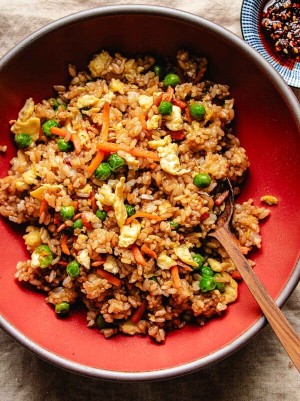 Image shows crisp rice grains and vegetables served in a red bowl Panda Express style.