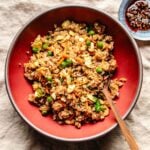 Recipe photo shows copycat Panda Express fried rice served in a red color bowl.