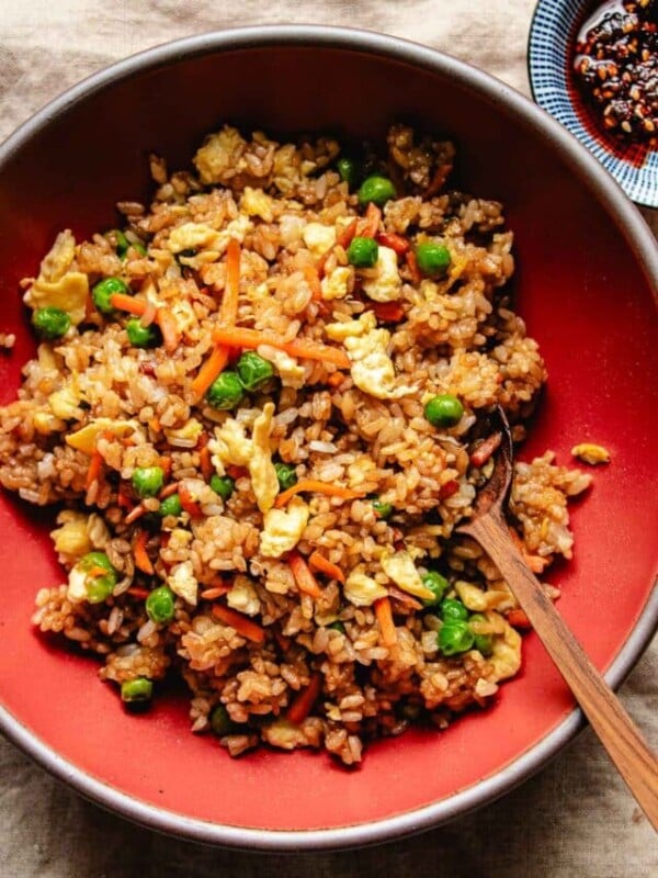 Image shows crisp rice grains and vegetables served in a red bowl Panda Express style.