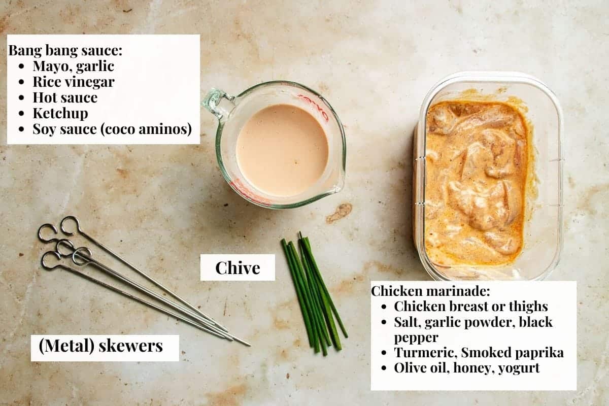Photo shows ingredients needed to make skewered bang bang chicken with sauce.