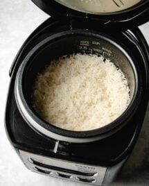Feature image shows sticky rice made in a rice cooker.