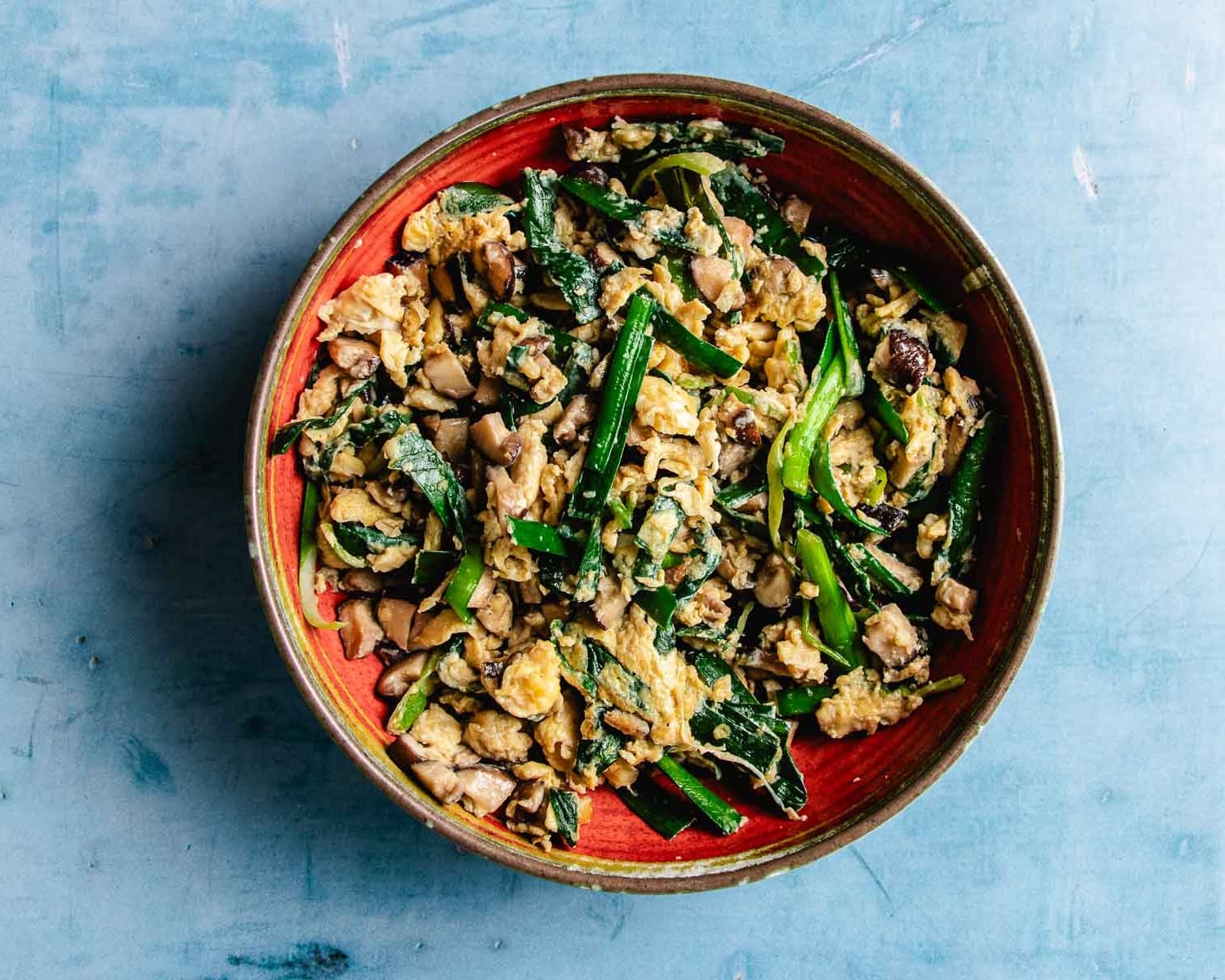 Image shows garlic chive and egg scramble for dumpling filling.