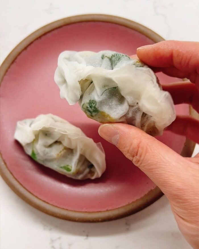 Person demos how to freezer dumplings made with rice paper wrappers.