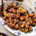 Recipe image shows air fryer delicata squash with honey and parmesan crust, served on a serving plate.