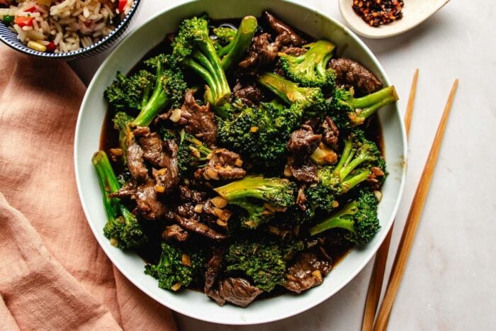 Image shows beef broccoli panda express copycat served over a big white plate.