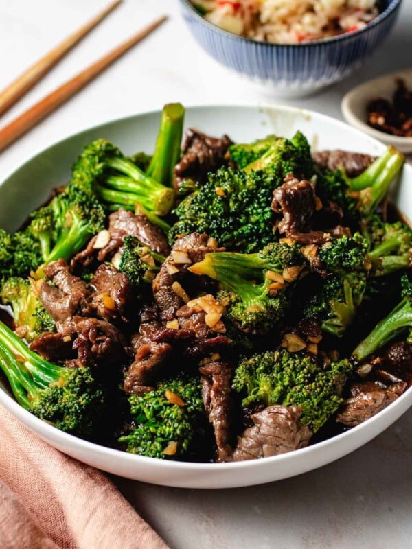 Feature image shows a plate of Panda Express broccoli beef, served with Panda fried rice on the side.