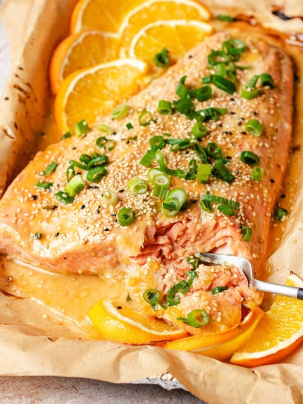 Feature image shows a whole slab of salmon with orange glaze and baked to flaky tender.